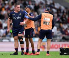 Ethan de Groot of the Highlanders receives medical attention during the round four Super Rugby...