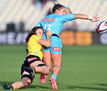 Amy du Plessis of Matatu offloads the ball during her side’s round five Super Rugby Aupiki match...