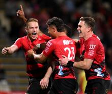 The Crusaders' Johnny McNicholl celebrates scoring a try against the Chiefs. Photo: Getty