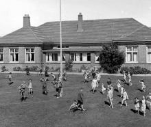 Children play outside Glendining Presbyterian Children’s Homes, Andersons Bay, in November 1950....