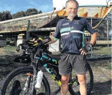 Kaiapoi cyclist Bruce Milsom in front of the benefactor of his fundraising marathon ride - The...