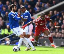 Everton's Andre Gomes and Ashley Young in action with Nottingham Forest's Callum Hudson-Odoi....