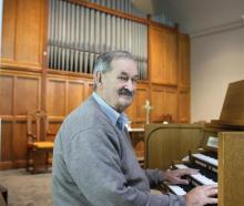 Baring Square Methodist Church parish steward Alister Smyth with the church’s new organ. Photo:...