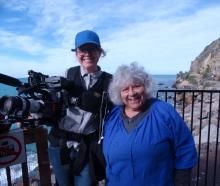 ABC crew member Olivia Peniston-Bird (left) joins Miriam Margolyes at the Oamaru Blue Penguin...