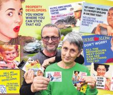 Rawhiti St residents Angela and Ian Formston hold their stickers objecting to council plans to...