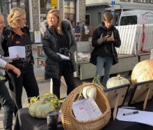 Judges discuss the merits of the finalists in the Arrowtown Autumn Festival Pumpkin Growing...