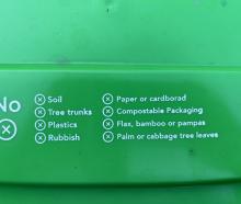 One of the Dunedin City Council's new green wheelie bins which has the word cardboard spelt...