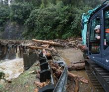 Crews working to clear a slip on State highway 6 near Franz Josef yesterday. Photo: Supplied via...
