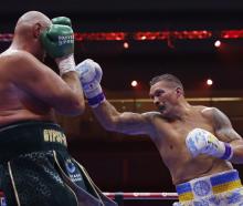 Oleksandr Usyk throws a right at Tyson Fury. Photo: Action Images via Reuters