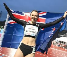 Anna Grimaldi celebrates after winning bronze at the World Para Athletics Championships in Kobe....