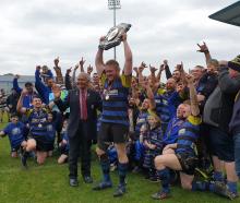 Invercargill Blues Captain Michael Peterson lifts the Galbraith Shield after his side beat Star...