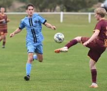 Raven August for The Dunedin City Royals (left) and University of Canterbury's Sam Neilson during...
