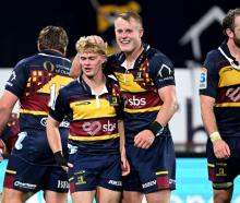 Highlanders Finn Hurley (L) and Sam Gilbert celebrate during their match against the Crusaders in...