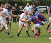 HSOB’s Josh Pitt carries the ball into contact against Sydenham in his side’s 20-19 win. PHOTO:...