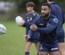 Highlanders winger Jona Nareki warms up during a training session at Forsyth Barr Stadium in...