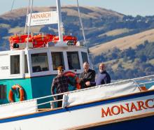 Outgoing owner of Monarch Wildlife Cruises and Tours Neil Harraway (centre) with new owners Ike ...