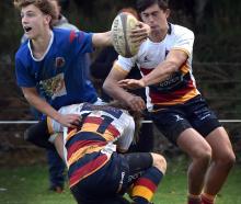 Southland Boys’ High School winger Cody Stevens is tackled by John McGlashan College winger Ethan...