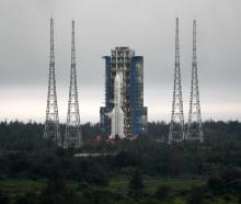 China's Chang'e-6 lunar mission rocket prepares to lift off from the Wenchang Satellite Launch...