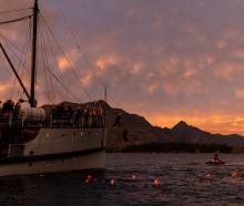 Legend swimmers come off TSS Earnslaw into Lake Wakatipu on Saturday morning. Photo: supplied