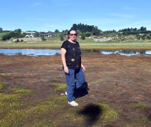 Justine Ragg, of Brighton, walks her Wavy Knowes, Waldronville, property where floodwater from...