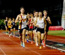 Ethan Smolej during Sam Ruthe’s (black singlet) sub-four minute mile attempt in Auckland. PHOTO:...