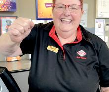 New World St Martins Lotto manager Karen Fleet gives a big cheer for the player who won $5.5m....
