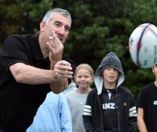 New North Otago coach Luke Herden works on some skills with pupils at St Clair School yesterday....