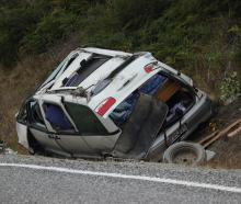 A van was badly damaged after a crash near Lake Hāwea. PHOTO: RAWAN SAADI