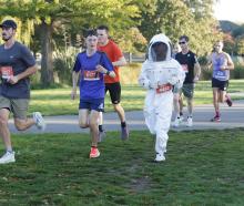Ryan Yoon broke his own world record for running a half-marathon in a beekeeping suit. He...