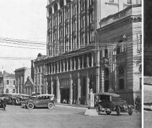 A new pillar marked "slow" and "keep left" diverts traffic from a row of cars parked&nbsp;in the...