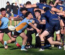 Halfbacks clash during the Dunedin premier rugby match between University and Dunedin at Logan...