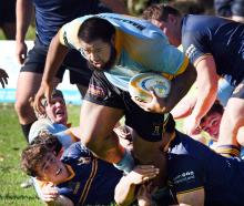 University prop Steve Salelea tries to get away from the Dunedin defence during the division 1...