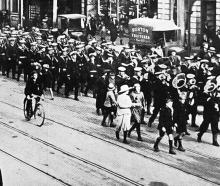 Sailors of the Royal Navy New Zealand Squadron flagship HMS Dunedin parade in Princes St, Dunedin...
