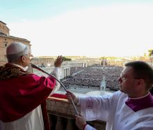 Newly elected Pope Leo XIV, Cardinal Robert Prevost of the United States speaks from the balcony...