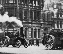 Steam traction engines haul a drum of replacement cable up Rattray St to the Roslyn cable car...