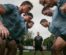 Otago assistant Will Henry watches the New Zealand under-85kg team pack down a scrum during a...