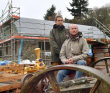 Lawrence couple Geraint Lewis and Rosana Gunton outside their half-finished dream home. PHOTO:...