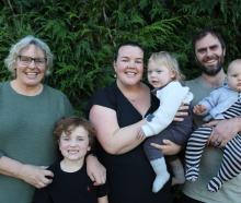 Surrounded by his family in Weston is (from left) grandmother Karen Fraser, older brother Hamish,...