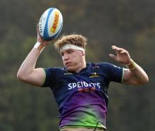 Highlanders lock Fabian Holland leaps high during a lineout drill at Logan Park earlier this week...
