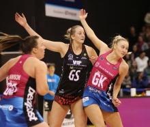 Carys Stythe of the Southern Steel and Eleanor Bird of the Mainland Tactix in action during today...