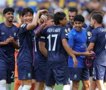 Auckland City players celebrate after drawing with Boca Juniors at the Club World Cup yesterday....