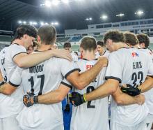 Black Sticks huddle before their game against Malaysia at the Nations Cup. PHOTO: SUPPLIED