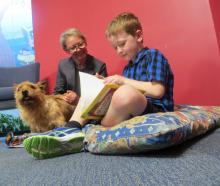 Ashburton librarian Jill Watson in 2016 with Riff Raff the reading dog and Riley Husband. PHOTO:...