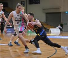 Nuggets player Darcy Knox darts low past Whai defender Denhym Brooke during their game at the...