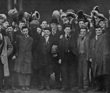 Young British men gather with New Zealand high commissioner Sir James Allen (centre) at Waterloo...