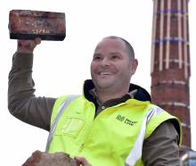 Project manager Paul Stevenson with a couple of the 4000 bricks rescued from the chimney of the...