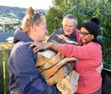 A tearful Visha Webster (right) hugs Affordable Firewood owner Pete Thompson and colleague Stacey...