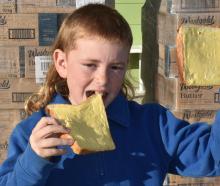 Fred Sutton, 9, cannot wait to show which side his bread is buttered on in Kaitangata yesterday....