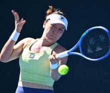 Lulu Sun plays a backhand against Danka Kovinic during their first round match in Melbourne...