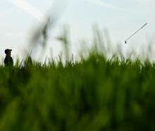 Rory McIlroy throws his club in frustration during a brutal day at the US Open at Oakmont. Photo:...